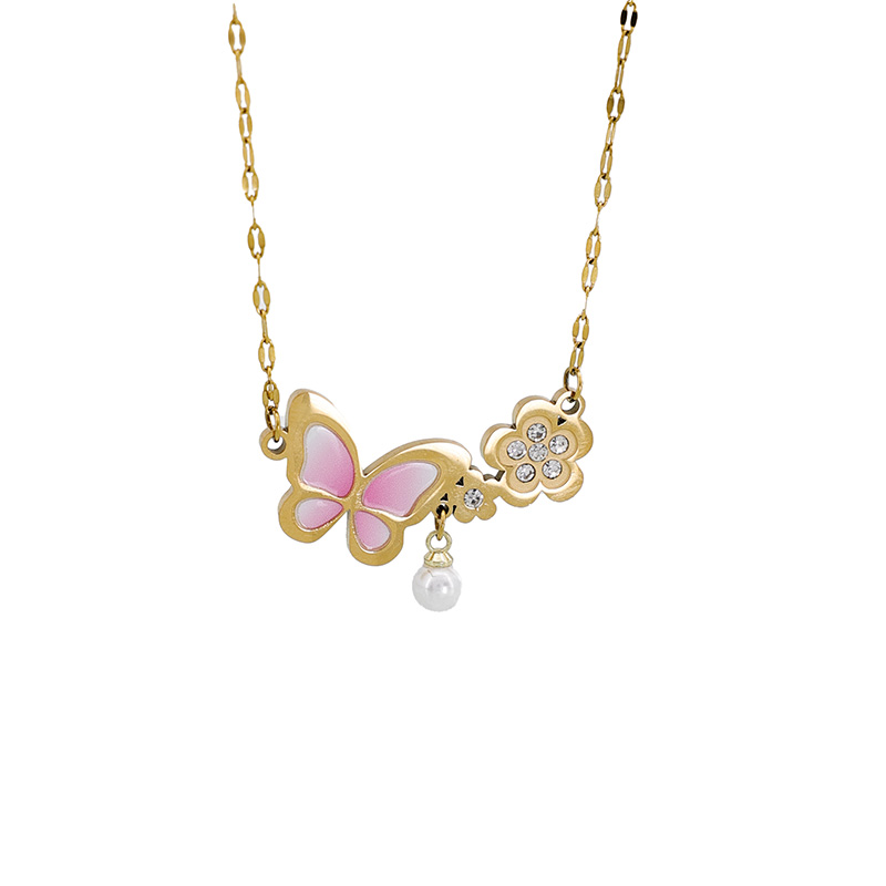 Pink Butterfly Flower Necklace with Pearl A pink enamel butterfly wing and gold plated flower pendant necklace with crystal accents and a white pearl drop.